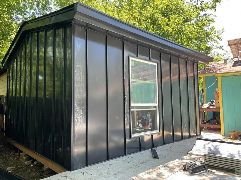 Black standing seam metal wall panels for Roof Inspection in Locust